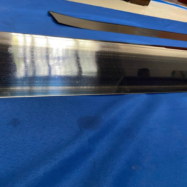 Alloy-coated scraping blade for paper-making drying cylinder